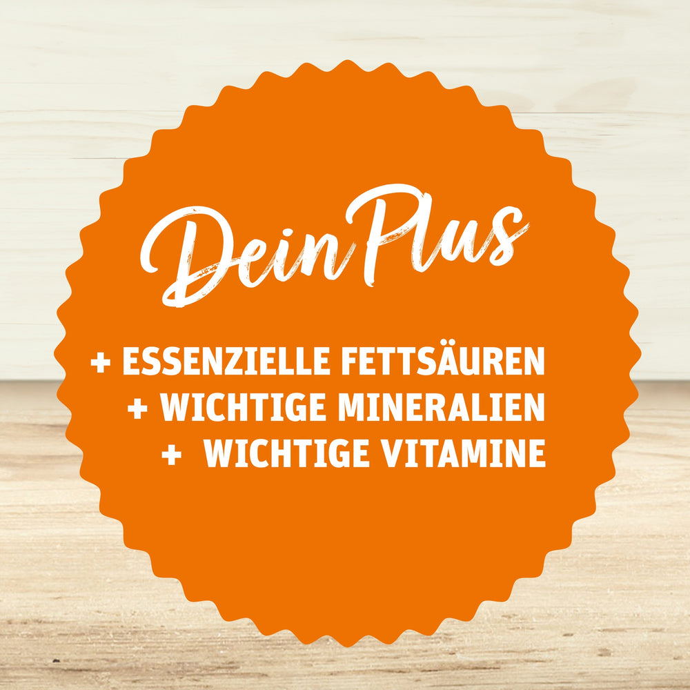 Orangefarbenes Siegel mit der Aufschrift ‚Dein Plus‘ und den Vorteilen: Essenzielle Fettsäuren, wichtige Mineralien, wichtige Vitamine